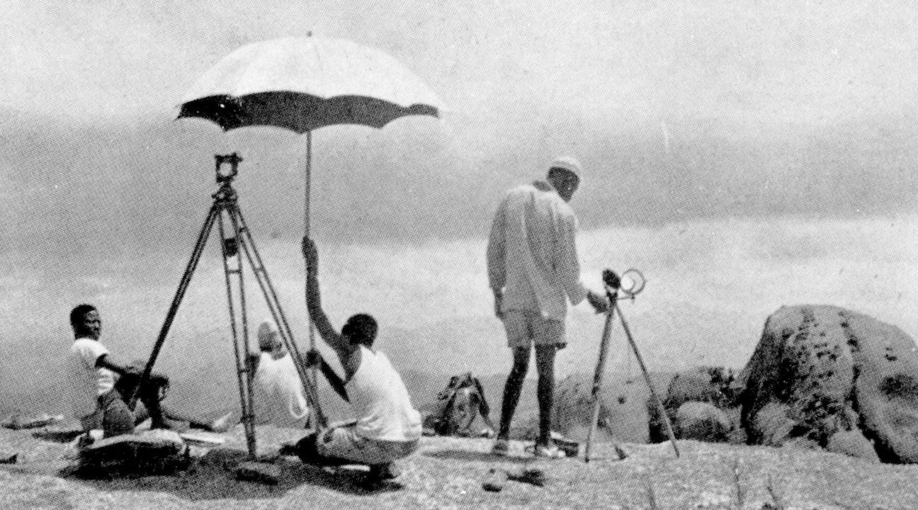 Monochrome image of figures in a landscape